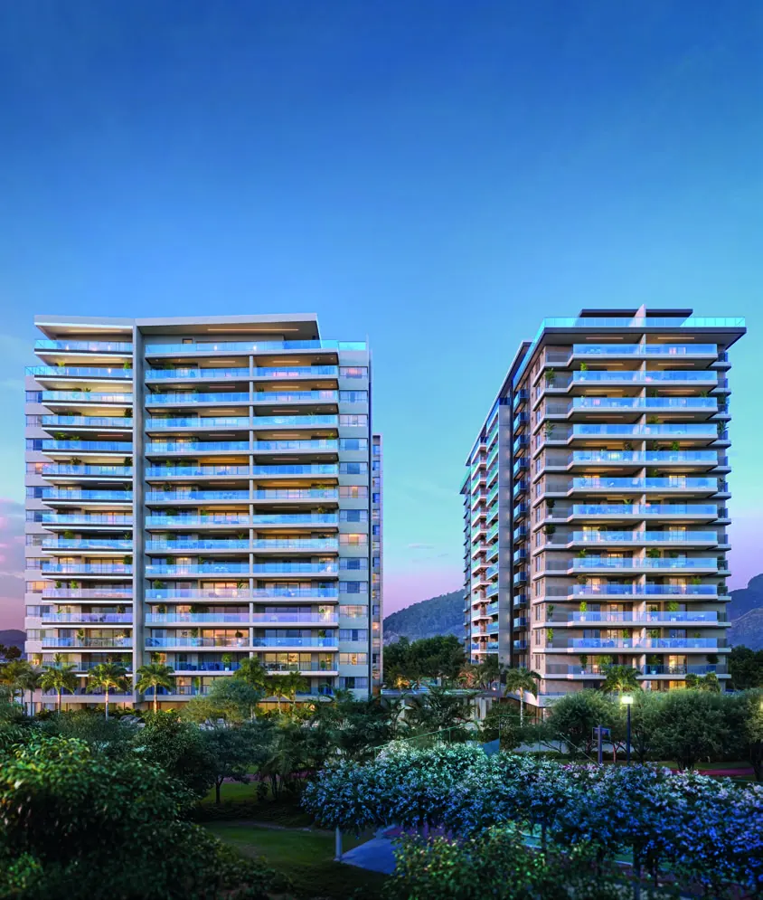 Edifícios do Gran Thai Leisure Residence ao entardecer, vistos do jardim